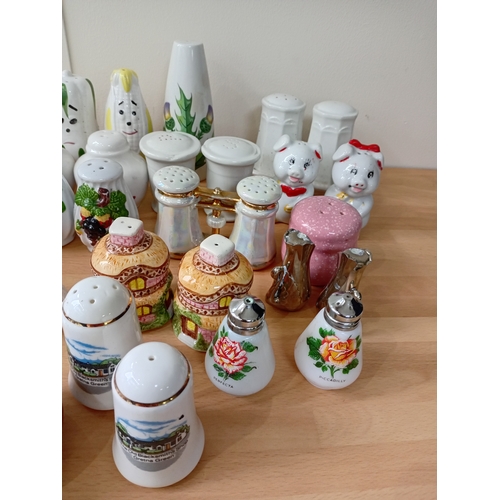 7 - A collection of ceramic salt and pepper shakers.