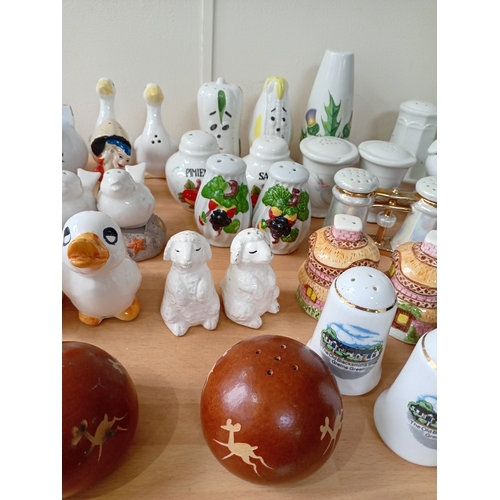7 - A collection of ceramic salt and pepper shakers.