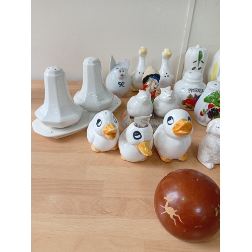 7 - A collection of ceramic salt and pepper shakers.