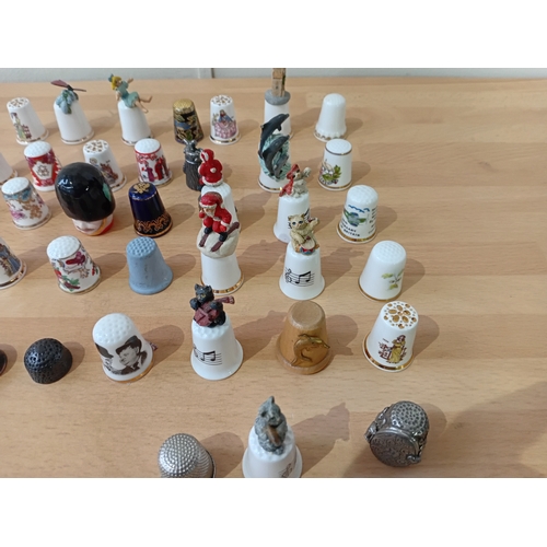 12 - a collection of thimbles: brands to include royal worcester, sterling, finsbury and one is cloisonne... 