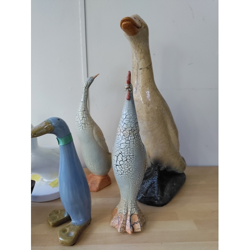 17 - A collection of decorative ducks and a chicken, ceramic and wood. the largest is 38cm in height. the... 