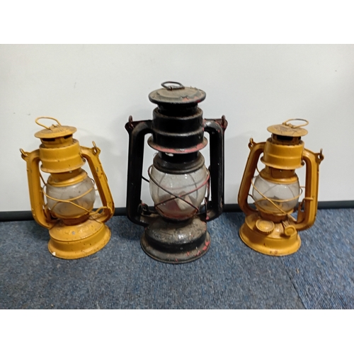 29 - Three hanging lamps together with three miniature coloured glass oil lamps