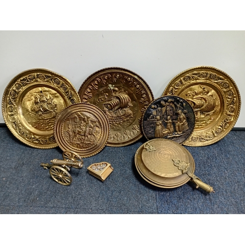 31 - A quantity of brass and copper including horns, a lamp, warming pan, horse brasses, plates etc