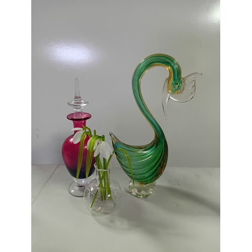51 - A collection of glassware including a Caithness Moonflower paperweight, murano style bird of paradis... 