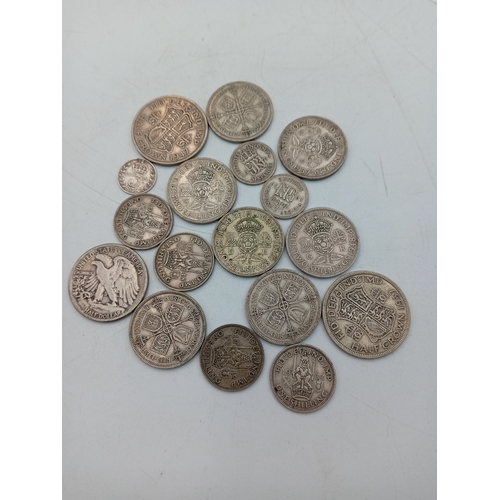 301 - A quantity of Pre-1947 British silver coinage including half crowns, shillings, two shillings and a ... 