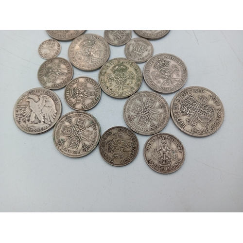 301 - A quantity of Pre-1947 British silver coinage including half crowns, shillings, two shillings and a ... 