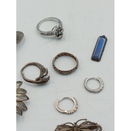 321 - A small mixed lot of jewellery including a silver ring, Butterfly pendant, two pairs of earrings tog... 