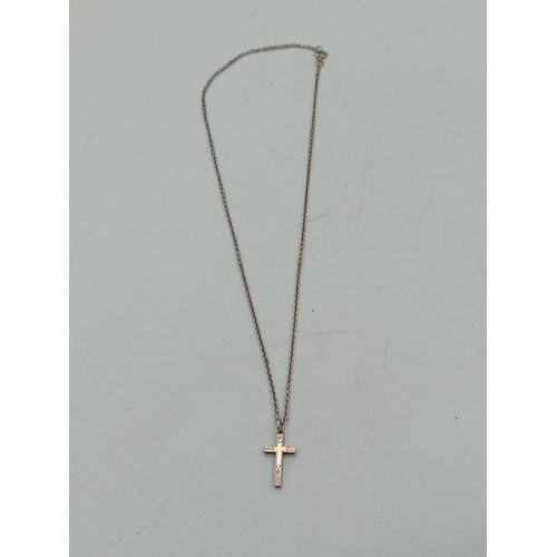 322 - A silver crucifix pendant on chain, cross stamped SILVER, chain stamped STERLING, chain 40cm long