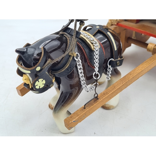 6 - A Ornamental Ceramic Shire Horse With a Romany Rose Wooden Traveller's Caravan.