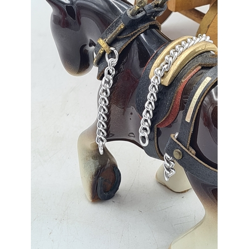 6 - A Ornamental Ceramic Shire Horse With a Romany Rose Wooden Traveller's Caravan.
