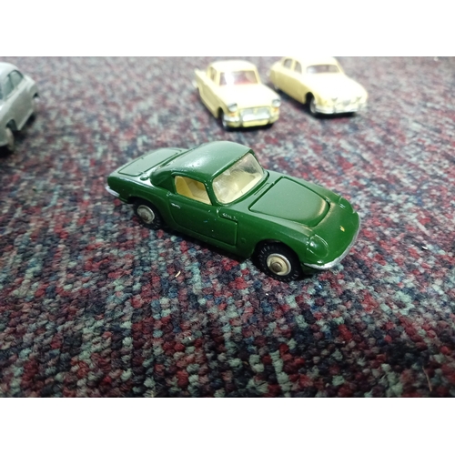 5 restored Dinky cars.