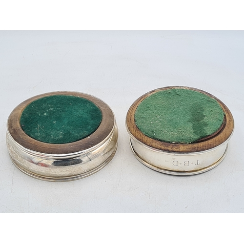258 - 2 Sterling Silver & Oak Bottle Coasters. One is engraved T.B.D. Each measures 12.5cm in diameter by ... 