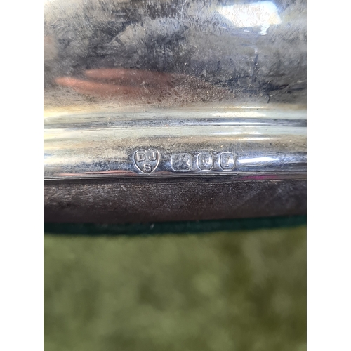 258 - 2 Sterling Silver & Oak Bottle Coasters. One is engraved T.B.D. Each measures 12.5cm in diameter by ... 