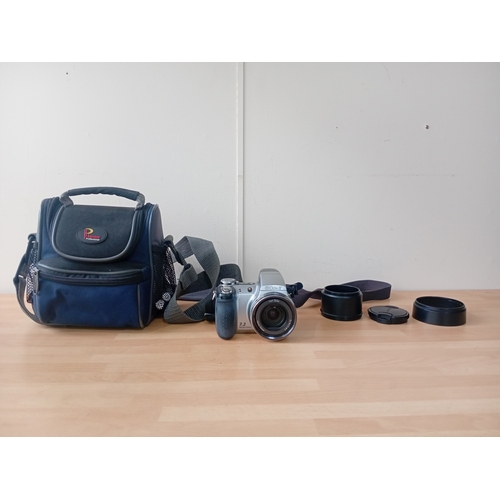 102 -  A Sony Cyber-shot DSC-H5 digital camera with a carrying case by laystor professional,and the cover ... 