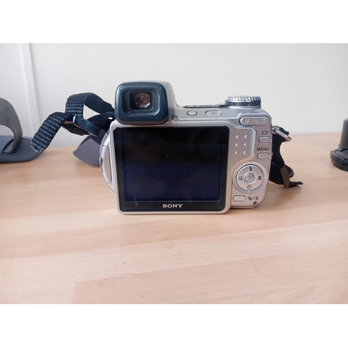 102 -  A Sony Cyber-shot DSC-H5 digital camera with a carrying case by laystor professional,and the cover ... 