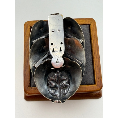 17 - A tested 500 silver handmade brooch with flux pearls and base metal clip.