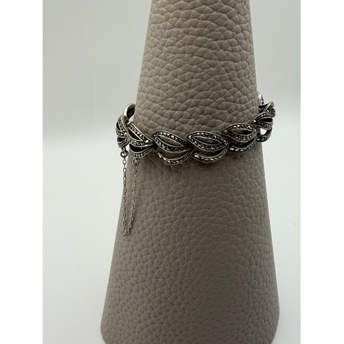 61 - A sterling silver Art Deco marcasite Bracelet.