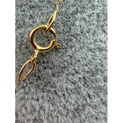 70 - A stamped 375 9ct gold necklace with a ball.