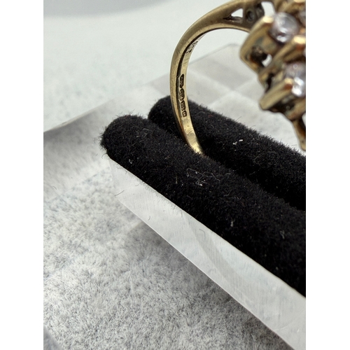 73 - A hallmarked 375 9ct gold cluster ring with CZ stones. Size L