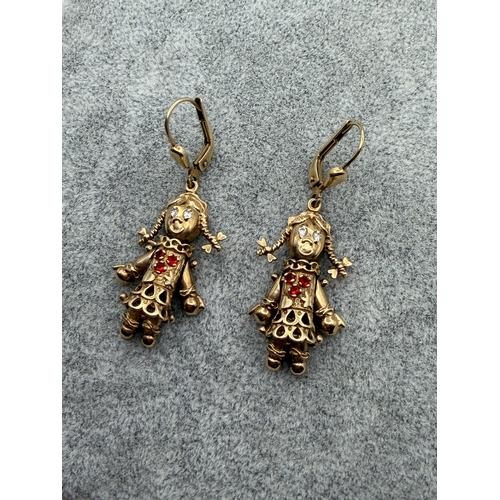 80 - A pair of stamped 375 9ct gold rag doll earrings.