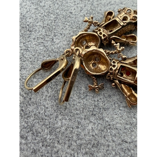 80 - A pair of stamped 375 9ct gold rag doll earrings.