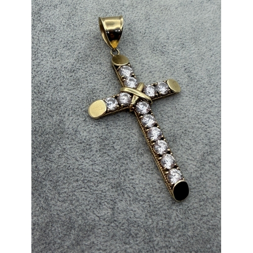 82 - A large 9ct Cross pendant with CZ stones.