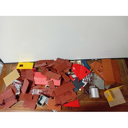 A collection of timpo building sets to includes, walls, roofs, and tents.