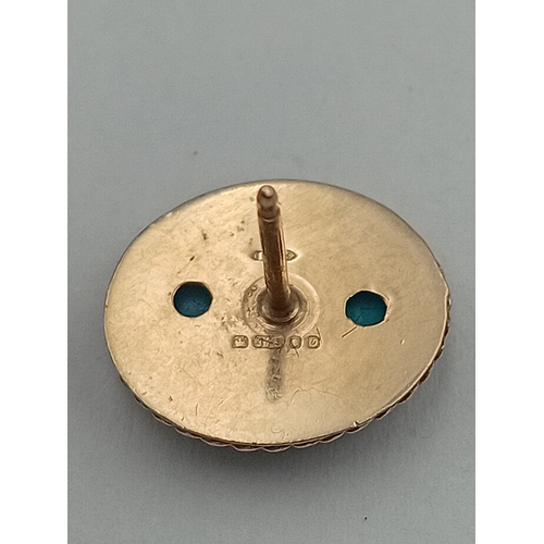 98 - A pair of stamped 375 9ct gold earrings set with turquoise stones.