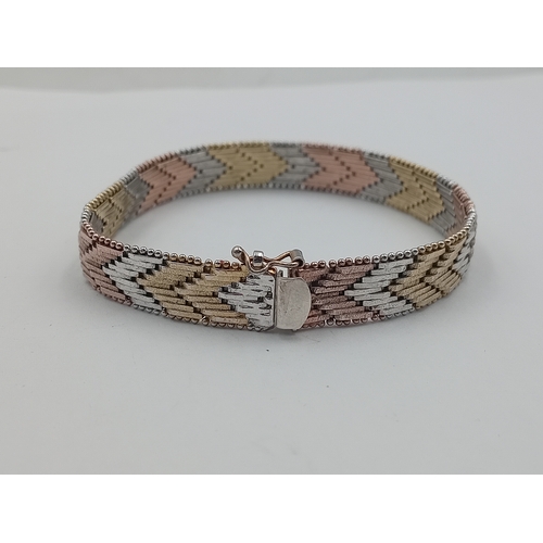 115 - A tested silver mixed coloured metal bracelet, stamped ITALY 925,18cm long
