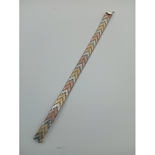 115 - A tested silver mixed coloured metal bracelet, stamped ITALY 925,18cm long