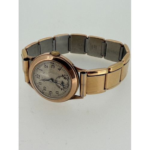 159 - A vintage 1940s working 9 carat gold watch with Swiss movement.