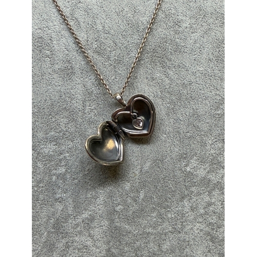 197 - A stamped 925 Pandora necklace with a love heart Locket featuring Cz. Length 26 inches.