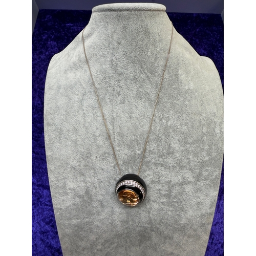 199 - A Belle Etoile Modernist orange cubic zirconia and enamel sterling silver pendant on silver change. ... 