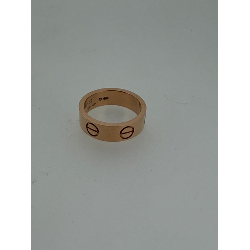 205 - A genuine Cartier love ring fully hallmarked in 18 karat gold with Cartier box.
