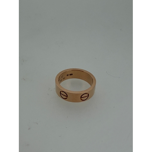 205 - A genuine Cartier love ring fully hallmarked in 18 karat gold with Cartier box.