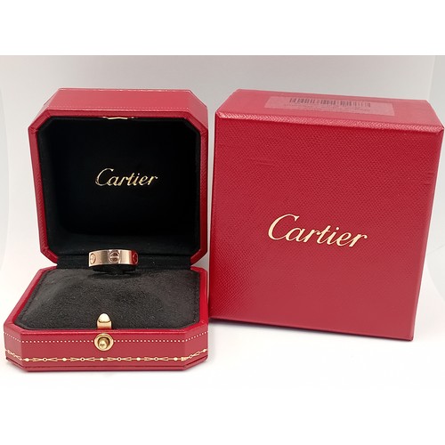 205 - A genuine Cartier love ring fully hallmarked in 18 karat gold with Cartier box.