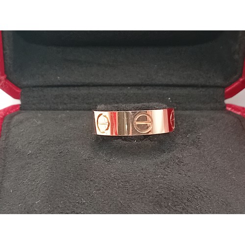 205 - A genuine Cartier love ring fully hallmarked in 18 karat gold with Cartier box.