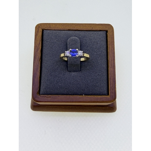 223 - A 18ct yellow gold trilogy design cushion cut sapphire and diamond engagement ring. Size I and 1/2. ... 