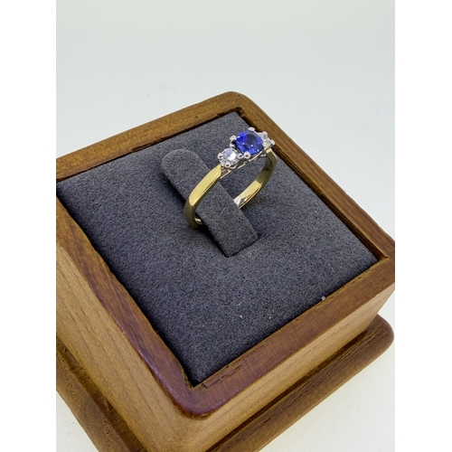 223 - A 18ct yellow gold trilogy design cushion cut sapphire and diamond engagement ring. Size I and 1/2. ... 