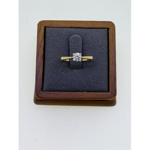 224 - A 18ct yellow gold solitaire engagement ring with a 3rd of a carat VVS2 diamond. Size N. Weight 3g.