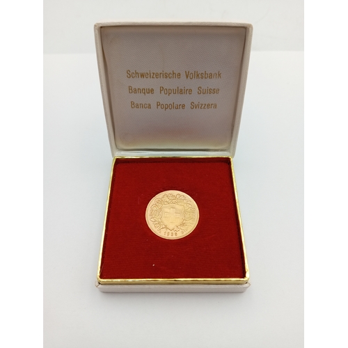 361 - A 1935 Swiss 20 Franc 0.900 Gold coin with box. Weight 6.46 Grams.
