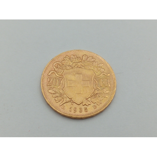 361 - A 1935 Swiss 20 Franc 0.900 Gold coin with box. Weight 6.46 Grams.