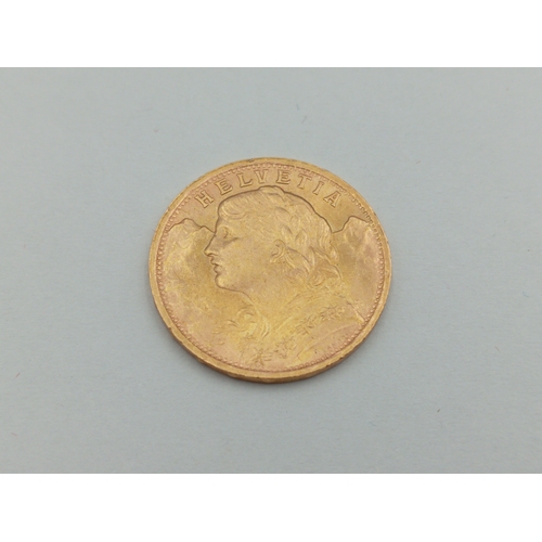 361 - A 1935 Swiss 20 Franc 0.900 Gold coin with box. Weight 6.46 Grams.