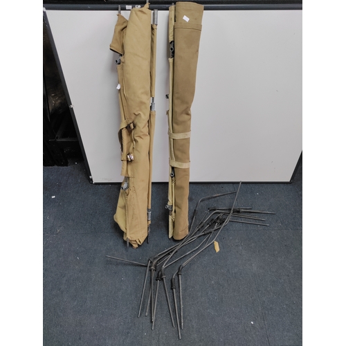 65 - A pair of military camp beds.