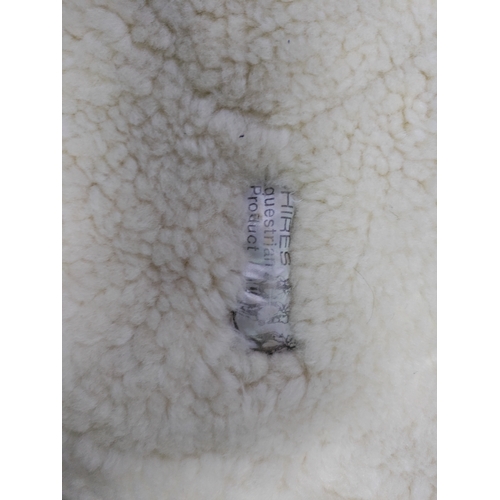 66 - A collection of 7 sheepskin wool saddle pads.