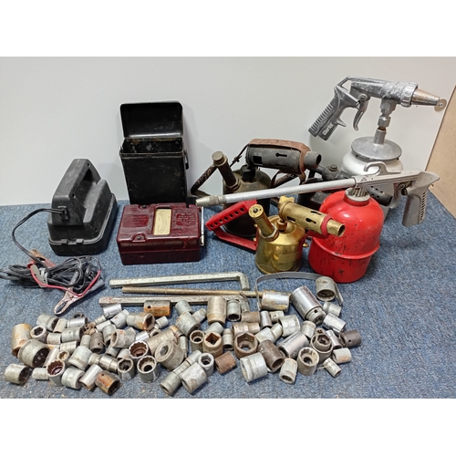 75 - A collection of tools. Featuring, blowtorch's, a Clarke gritblast gun, Evershed & Vignoles Megger in... 