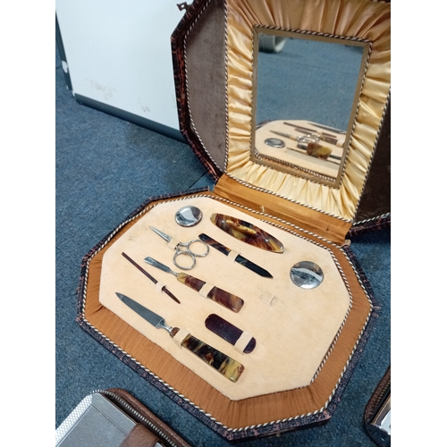 82 - A trio of vintage Men's grooming sets. To include Real pigskin & cowhide cases.