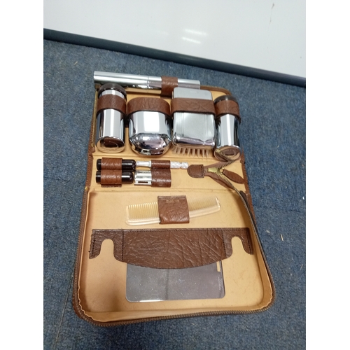82 - A trio of vintage Men's grooming sets. To include Real pigskin & cowhide cases.