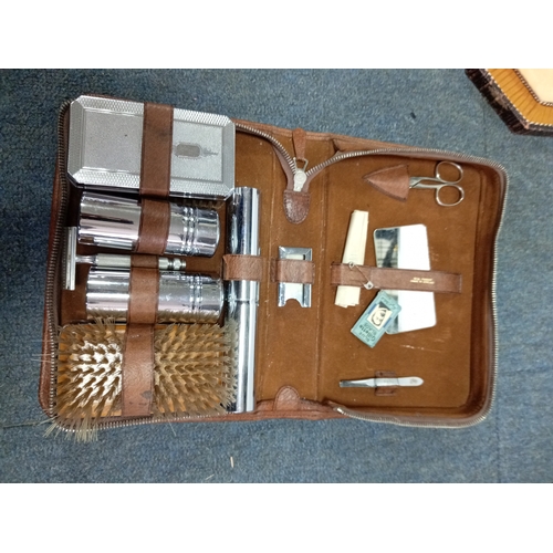 82 - A trio of vintage Men's grooming sets. To include Real pigskin & cowhide cases.