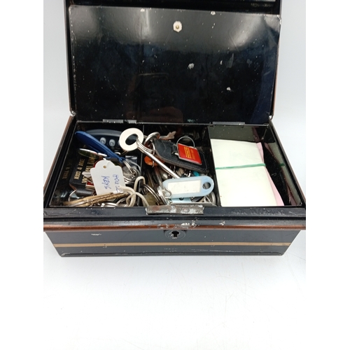 89 - A vintage security box full of keys & a vintage motorists first aid tin with contents.